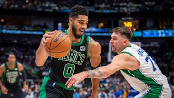 Nov 6, 2021; Dallas, Texas, USA; Dallas Mavericks guard Luka Doncic (77) defends against Boston Celtics forward Jayson Tatum (0) during the first quarter at the American Airlines Center. Mandatory Credit: Jerome Miron-USA TODAY Sports