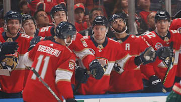 SUNRISE, FL - MARCH 08: Teammates congratulate Jonathan Huberdeau #11 of the Florida Panthers after he scored a goal against the Minnesota Wild during first period action at the BB&T Center on March 8, 2019 in Sunrise, Florida. (Photo by Joel Auerbach/Icon Sportswire via Getty Images)