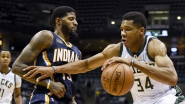 Oct 19, 2016; Milwaukee, WI, USA; Milwaukee Bucks forward Giannis Antetokounmpo (34) tries to get past Indiana Pacers forward Paul George (13) in the third quarter at BMO Harris Bradley Center. Mandatory Credit: Benny Sieu-USA TODAY Sports