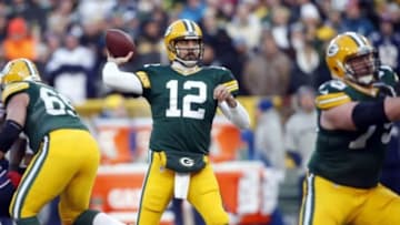 Nov 30, 2014; Green Bay, WI, USA; Green Bay Packers quarterback Aaron Rodgers (12) throws a pass during the first half against the New England Patriots at Lambeau Field. Mandatory Credit: Chris Humphreys-USA TODAY Sports
