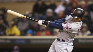 Apr 27, 2016; Minneapolis, MN, USA; Cleveland Indians left fielder Michael Brantley (23) hits a RBI fly ball in the fifth inning against the Minnesota Twins at Target Field. Mandatory Credit: Jesse Johnson-USA TODAY Sports