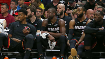 From left, Miami Heat players Hassan Whiteside, Dwyane Wade, Wayne Ellington and Bam Adebayo look from the bench during overtime against the Brooklyn Nets at the AmericanAirlines Arena in Miami on Saturday, March 31, 2018. The Nets won, 110-109, in OT. (David Santiago/El Nuevo Herald/TNS via Getty Images)