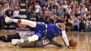 Jan 10, 2017; Toronto, Ontario, CAN; Toronto Raptors forward DeMarre Carroll (5) wins a battle for a loose ball against Boston Celtics forward Jae Crowder (99) at Air Canada Centre. The Raptors beat the Celtics 114-106. Mandatory Credit: Tom Szczerbowski-USA TODAY Sports