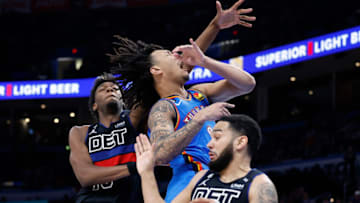 Detroit Pistons center James Wiseman (13) fouls Oklahoma City Thunder forward Jaylin Williams (6) Credit: Alonzo Adams-USA TODAY Sports
