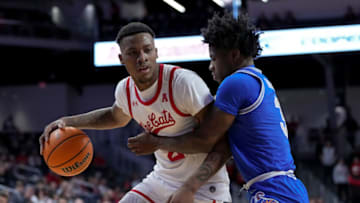 Cincinnati Bearcats forward Landers Nolley II defended by Memphis Tigers guard Kendric Davis. Getty Images.