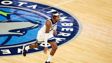 MINNEAPOLIS, MINNESOTA - DECEMBER 14: Rondae Hollis-Jefferson #24 of the Minnesota Timberwolves dribbles the ball against the Memphis Grizzlies during the preseason game at Target Center on December 14, 2020 in Minneapolis, Minnesota. The Grizzlies defeated the Timberwolves 123-104. NOTE TO USER: User expressly acknowledges and agrees that, by downloading and or using this Photograph, user is consenting to the terms and conditions of the Getty Images License Agreement (Photo by Hannah Foslien/Getty Images)