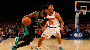 NEW YORK, NY - OCTOBER 20: Kyrie Irving #11 of the Boston Celtics dribbles the ball against Allonzo Trier #14 of the New York Knicks at Madison Square Garden on October 20, 2018 in New York City. (Photo by Mike Stobe/Getty Images)