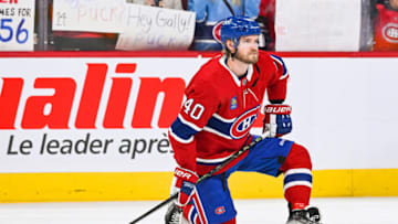Apr 4, 2023; Montreal, Quebec, CAN; Montreal Canadiens right wing Joel Armia (40) kneels on the ice while watching his teammates during warm-up before the game against the Detroit Red Wings at Bell Centre. Mandatory Credit: David Kirouac-USA TODAY Sports