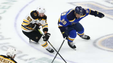 ST LOUIS, MISSOURI - JUNE 09: Brad Marchand #63 of the Boston Bruins battles for the puck with Vince Dunn #29 of the St. Louis Blues during the third period in Game Six of the 2019 NHL Stanley Cup Final at Enterprise Center on June 09, 2019 in St Louis, Missouri. (Photo by Dilip Vishwanat/Getty Images)