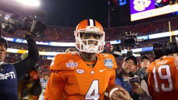 Dec 5, 2015; Charlotte, NC, USA; Clemson Tigers quarterback Deshaun Watson (4) walks off the field after defeating the North Carolina Tar Heels 45-37 in the ACC football championship game at Bank of America Stadium. Mandatory Credit: Joshua S. Kelly-USA TODAY Sports