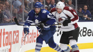 TORONTO, ON - OCTOBER 8: Tyson Barrie #4 of the Colorado Avalanche battles against Nazem Kadri #43 of the Toronto Maple Leafs during an NHL game at the Air Canada Centre on October 8, 2013 in Toronto, Ontario, Canada. The Avalanche defeated the Leafs 2-1. (Photo by Claus Andersen/Getty Images)
