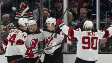 New Jersey Devils, from left, forward Nathan Bastian (14), forward Michael McLeod (20), defenseman Colton White (2) and forward Tomas Tatar (90) celebrate a goal during the third period against the Seattle Kraken at Climate Pledge Arena. Mandatory Credit: Stephen Brashear-USA TODAY Sports