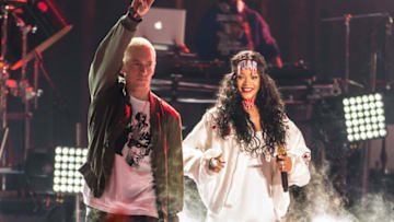 LOS ANGELES, CA - APRIL 13: Recording artists Eminem (L) and Rihanna perform onstage at the 2014 MTV Movie Awards at Nokia Theatre L.A. Live on April 13, 2014 in Los Angeles, California. (Photo by Christopher Polk/Getty Images for MTV)
