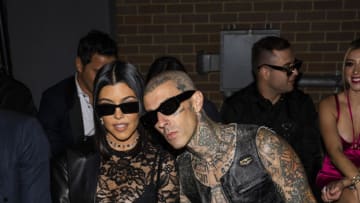 NEW YORK, NEW YORK - SEPTEMBER 13: Kourtney Kardashian (L) and Travis Barker attend the Boohoo X Kourtney Kardashian fashion show during New York Fashion Week: The Shows on the High Line on September 13, 2022 in New York City. (Photo by Gotham/WireImage)