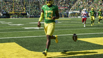 Sep 4, 2021; Eugene, Oregon, USA; Oregon Ducks quarterback Anthony Brown (13) scores a touchdown during the second half against the Fresno State Bulldogs at Autzen Stadium. The Ducks won the game 31-24. Mandatory Credit: Troy Wayrynen-USA TODAY Sports