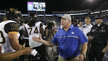 Sep 3, 2016; Lexington, KY, USA; Kentucky Wildcats head coach Mark Stoops shakes hands with Southern Mississippi Golden Eagles head coach Jay Hopson after the game at Commonwealth Stadium. Southern Mississippi defeated Kentucky 44-35. Mandatory Credit: Mark Zerof-USA TODAY Sports