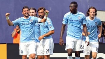 Jul 26, 2015; New York, NY, USA; New York City FC forward David Villa (7) celebrates with teammates after a goal against the Orlando City FC during the second half of a soccer match at Yankee Stadium. The New York City FC won 5-3. Mandatory Credit: Adam Hunger-USA TODAY Sports