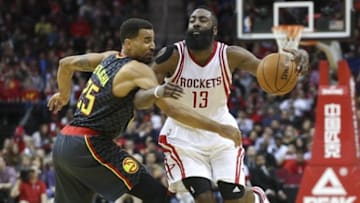 Dec 29, 2015; Houston, TX, USA; Houston Rockets guard James Harden (13) moves the ball as Atlanta Hawks forward Thabo Sefolosha (25) defends during the third quarter at Toyota Center. The Hawks defeated the Rockets 121-115. Mandatory Credit: Troy Taormina-USA TODAY Sports