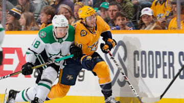 NASHVILLE, TN - DECEMBER 27: Ryan Hartman #38 of the Nashville Predators skates against Tyler Pitlick #18 of the Dallas Stars at Bridgestone Arena on December 27, 2018 in Nashville, Tennessee. (Photo by John Russell/NHLI via Getty Images)