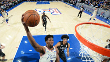 PHILADELPHIA, PA - MARCH 16: Joel Embiid #21 of the Philadelphia 76ers goes up for the dunk against the Brooklyn Nets at the Wells Fargo Center on March 16, 2018 in Philadelphia, Pennsylvania NOTE TO USER: User expressly acknowledges and agrees that, by downloading and/or using this Photograph, user is consenting to the terms and conditions of the Getty Images License Agreement. Mandatory Copyright Notice: Copyright 2018 NBAE (Photo by Jesse D. Garrabrant/NBAE via Getty Images)