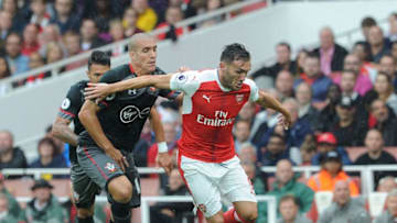 LONDON, ENGLAND - SEPTEMBER 10: Lucas Perez of Arsenal takes on Oriol Romeu of Southampton during the Premier League match between Arsenal and Southampton at Emirates Stadium on September 10, 2016 in London, England. (Photo by David Price/Arsenal FC via Getty Images)
