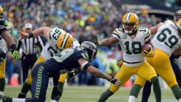 Jan 18, 2015; Seattle, WA, USA; Green Bay Packers wide receiver Randall Cobb (18) carries the ball as he is pursued by Seattle Seahawks free safety Earl Thomas (29) during the second quarter in the NFC Championship Game at CenturyLink Field. Mandatory Credit: Kirby Lee-USA TODAY Sports