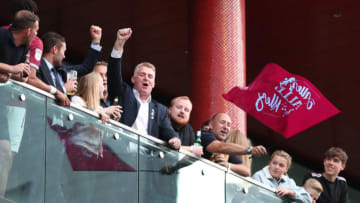 LONDON, ENGLAND - MAY 27: Dean Smith manager of Aston Villa celebrates promotion to the Premier League on the balcony of the team hotel in front of waiting fans after the Sky Bet Championship Play-off Final match between Aston Villa and Derby County at Wembley Stadium on May 27, 2019 in London, United Kingdom. (Photo by Catherine Ivill/Getty Images)