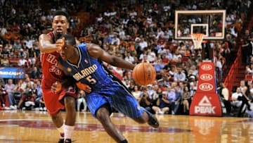 Nov 23, 2013; Miami, FL, USA; Orlando Magic shooting guard Victor Oladipo (5) is pressured by Miami Heat point guard Norris Cole (30) during the first quarter at American Airlines Arena. Mandatory Credit: Steve Mitchell-USA TODAY Sports