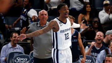 Oct 3, 2022; Memphis, Tennessee, USA; Memphis Grizzlies guard Ja Morant (12) reacts after a dunk during the first half against the Orlando Magic at FedExForum. Mandatory Credit: Petre Thomas-USA TODAY Sports
