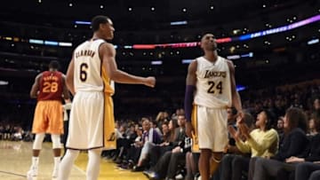 Nov 29, 2015; Los Angeles, CA, USA; Los Angeles Lakers forward Kobe Bryant (24) and guard Jordan Clarkson (6) react against the Indiana Pacers in the second half at Staples Center. Mandatory Credit: Richard Mackson-USA TODAY Sports