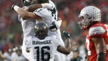 Nov 21, 2015; Columbus, OH, USA; Michigan State Spartans fullback Trevon Pendleton (37) celebrates with Spartans quarterback Damion Terry (6) after scoring a touchdown against the Ohio State Buckeyes in the second quarter at Ohio Stadium. Mandatory Credit: Geoff Burke-USA TODAY Sports