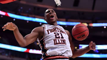 Dec 17, 2016; Chicago, IL, USA; Illinois Fighting Illini guard Malcolm Hill (21) reacts after dunking the ball against the Brigham Young Cougars during the second half at the United Center. Illinois defeats Brigham Young 75-73. Mandatory Credit: Mike DiNovo-USA TODAY Sports