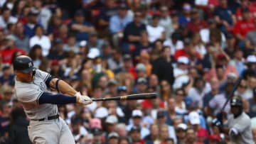 BOSTON, MA - SEPTEMBER 29: Giancarlo Stanton #27 of the New York Yankees hits a home run at the top of the seventh inning of the game against the Boston Red Sox at Fenway Park on September 29, 2018 in Boston, Massachusetts. (Photo by Omar Rawlings/Getty Images)