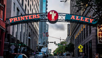 Printers Alley: Founded in 1828, the area runs between Third and Fourth avenues from Union to Commerce streets. Traditionally the center of Nashville's nightlife, in its earlier days the alley was a series of posts where men bound for the nearby courthouse and saloons hitched their horses. By the early 19th century, the alley became the center of Nashville’s printing industry. At one time, Nashville’s two largest newspapers, The Tennessean and the Nashville Banner, had offices here.Downtown 25