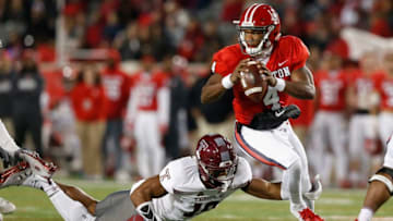 HOUSTON, TX - NOVEMBER 10: D'Eriq King #4 of the Houston Cougars is forced to scramble out of the pocket under pressure by Isaiah Graham-Mobley #19 of the Temple Owls in the first half at TDECU Stadium on November 10, 2018 in Houston, Texas. (Photo by Tim Warner/Getty Images)