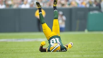 Sep 25, 2016; Green Bay, WI, USA; Green Bay Packers wide receiver Randall Cobb (18) tumbles after missing a catch during the fourth quarter against the Detroit Lions at Lambeau Field. Green Bay won 34-27. Mandatory Credit: Jeff Hanisch-USA TODAY Sports