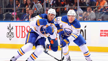 ELMONT, NEW YORK - OCTOBER 14: Kyle Okposo #21 and JJ Peterka #77 of the Buffalo Sabres skates against the New York Islanders during the first period at UBS Arena on October 14, 2023 in Elmont, New York. (Photo by Bruce Bennett/Getty Images)