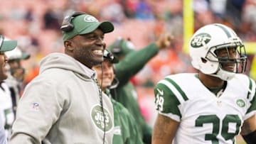 Oct 30, 2016; Cleveland, OH, USA; New York Jets head coach Todd Bowles and New York Jets defensive back Antonio Allen (39) smile following an interception against the Cleveland Browns during the fourth quarter at FirstEnergy Stadium. The Jets won 31-28. Mandatory Credit: Scott R. Galvin-USA TODAY Sports
