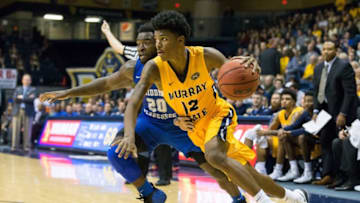 MURRAY, KY - NOVEMBER 13: Middle Tennessee guard Giddy Potts (20) reaches in on Murray State guard Temetrius "Ja" Morant (12) as he drives to the basket during the college basketball game between the Murray State Racers and Middle Tennessee Blue Raiders on November 13, 2017 at the CFSB Center in Murray, KY. (Photo by Stephen Furst/Icon Sportswire via Getty Images)