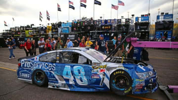 Mar 11, 2016; Avondale, AZ, USA; A tow truck tows the damaged car of NASCAR Sprint Cup Series driver Jimmie Johnson after crashing during qualifying for the Good Sam 500 at Phoenix International Raceway. Mandatory Credit: Mark J. Rebilas-USA TODAY Sports