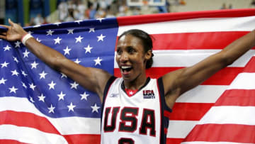 GREECE - AUGUST 28: Lisa Leslie of the U.S. joyfully holds up an American flag after the women's basketball team defeated Australia, 74-63, in the gold medal match at the Olympic Indoor Hall during the 2004 Summer Olympic Games in Athens. (Photo by Corey Sipkin/NY Daily News Archive via Getty Images)