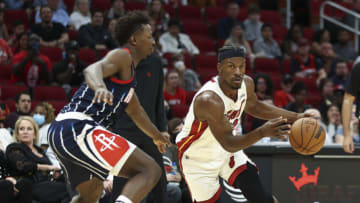 Miami Heat forward Jimmy Butler (22) controls the ball as Houston Rockets forward Jae'Sean Tate (8) defends(Troy Taormina-USA TODAY Sports)