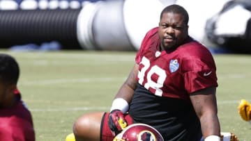 Aug 1, 2015; Richmond, VA, USA; Washington Redskins defensive tackle Terrance Knighton (98) stretches on the field during afternoon practice as part of day three of training camp at Bon Secours Washington Redskins Training Center. Mandatory Credit: Geoff Burke-USA TODAY Sports