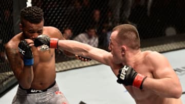 MOSCOW, RUSSIA - SEPTEMBER 15: (R-L) Merab Dvalishvili of Georgia punches Terrion Ware in their bantamweight bout during the UFC Fight Night event at Olimpiysky Arena on September 15, 2018 in Moscow, Russia. (Photo by Jeff Bottari/Zuffa LLC/Zuffa LLC via Getty Images)