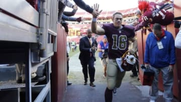 Oct 19, 2014; Landover, MD, USA; Washington Redskins quarterback Colt McCoy (16) runs off the field after the Redskins game against the Tennessee Titans at FedEx Field. The Redskins won 19-17. Mandatory Credit: Geoff Burke-USA TODAY Sports