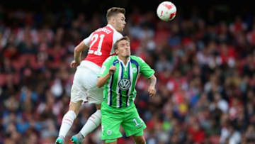 LONDON, ENGLAND - JULY 26: Calum Chambers of Arsenal outjumps Max Kruse during the Emirates Cup match between Arsenal and VfL Wolfsburg at the Emirates Stadium on July 26, 2015 in London, England. (Photo by David Rogers/Getty Images)