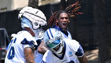 Jul 29, 2022; Onxard, CA, USA; Dallas Cowboys wide receiver T.J. Vasher (16) is congratulated by tackle Aviante Collins (76) and wide receiver CeeDee Lamb (88) after catching a touchdown pass in the end zone during training camp drills at River Ridge Fields in Oxnard, CA. Mandatory Credit: Jayne Kamin-Oncea-USA TODAY Sports