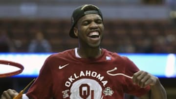March 26, 2016; Anaheim, CA, USA; Oklahoma Sooners guard Buddy Hield (24) cuts the net and celebrates the 80-68 victory against Oregon Ducks to win the West regional final of the NCAA Tournament at Honda Center. Mandatory Credit: Richard Mackson-USA TODAY Sports