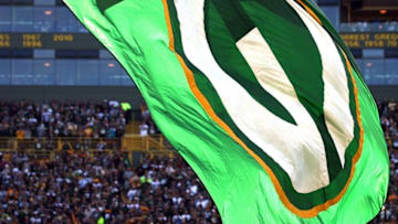 Sept. 30, 2012; Green Bay, WI, USA; The Green Bay Packer logo is flown by a Green Bay Packers cheerleader as their team plays the New Orleans Saints at Lambeau Field. The Green Bay Packers defeated the New Orleans Saints 28-27. Mandatory Credit: Mary Langenfeld-USA TODAY Sports