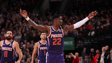 Deandre Ayton #22 of the Phoenix Suns reacts to a play against the Portland Trail Blazers on December 30, 2019 at the Moda Center Arena in Portland, Oregon. NOTE TO USER: User expressly acknowledges and agrees that, by downloading and or using this photograph, user is consenting to the terms and conditions of the Getty Images License Agreement. Mandatory Copyright Notice: Copyright 2019 NBAE (Photo by Cameron Browne/NBAE via Getty Images)